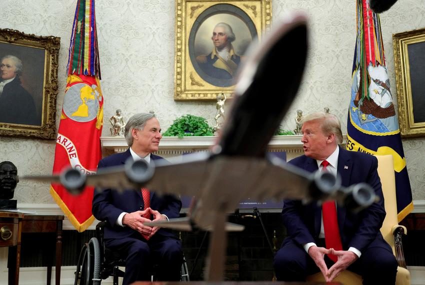 President Donald Trump speaks with Gov. Greg Abbott  in the Oval Office on May  7, 2020.
